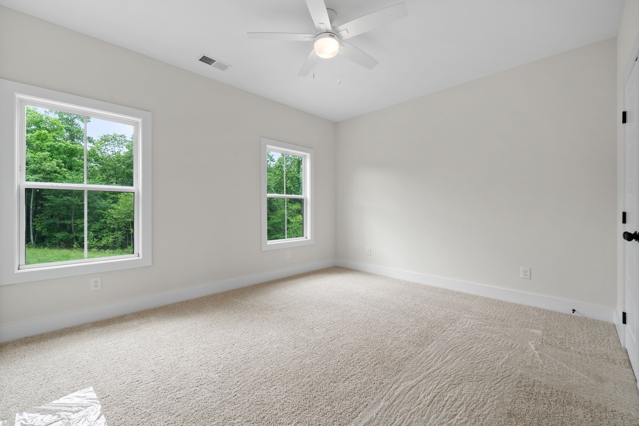197 Dewberry Road Clarksville, TN 37042 - Photo 30 of 59 an empty room with a window and a ceiling fan