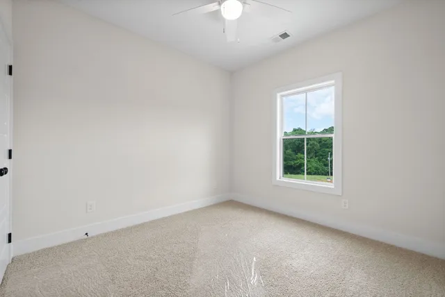 a view of a balcony with wooden floor