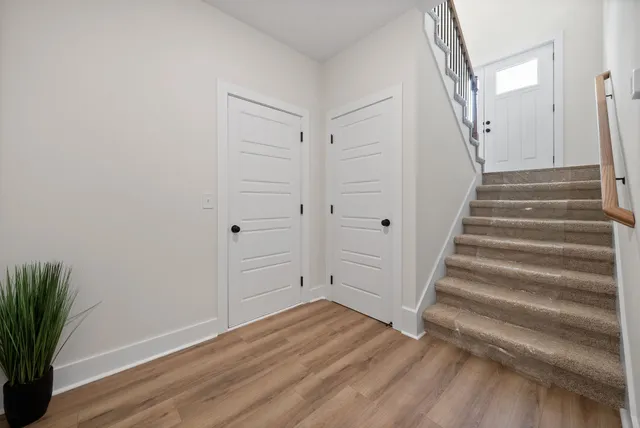 an aerial view of a house with a yard basket ball court and outdoor seating