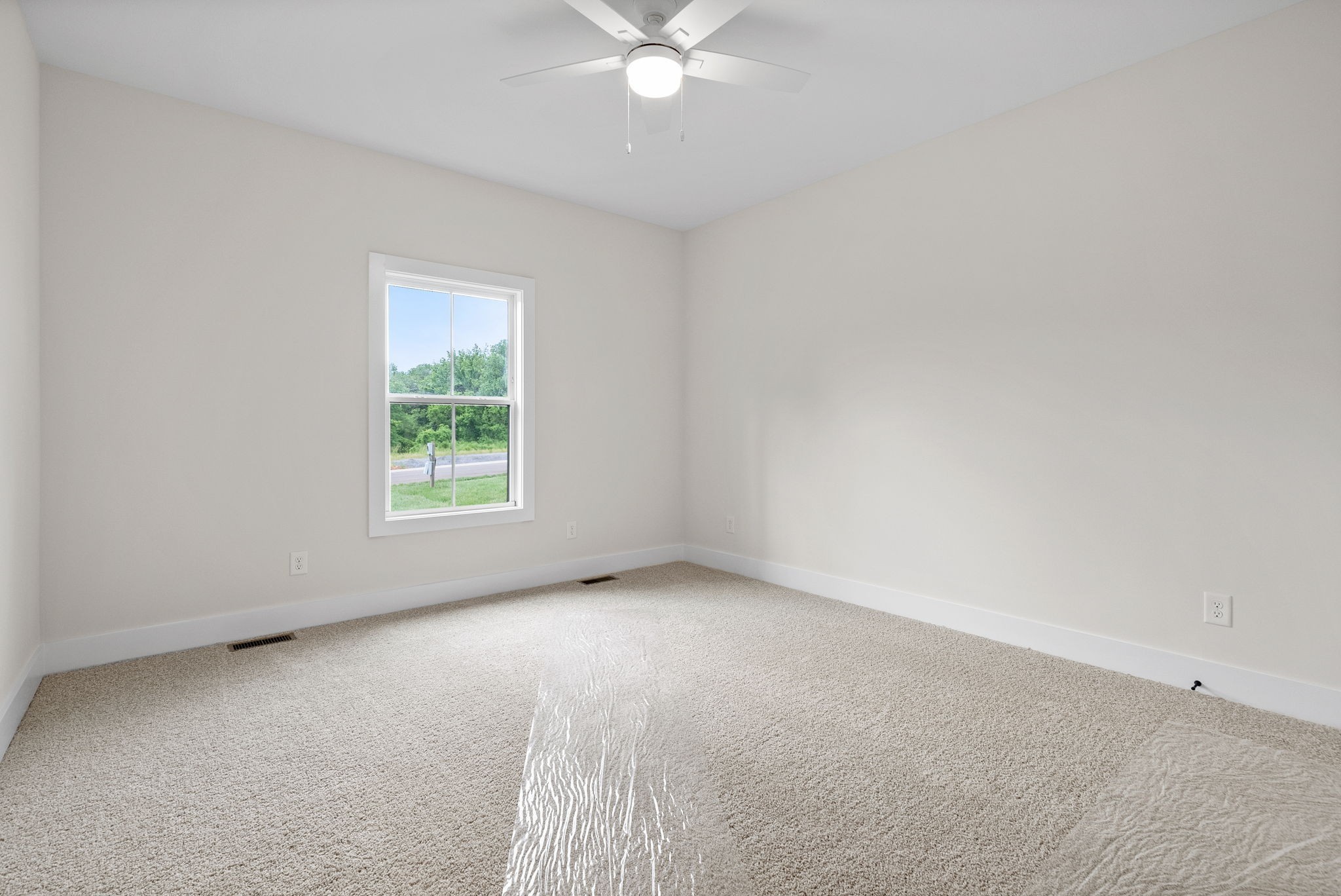 197 Dewberry Road Clarksville, TN 37042 - Photo 44 of 59 an empty room with a window and a ceiling fan