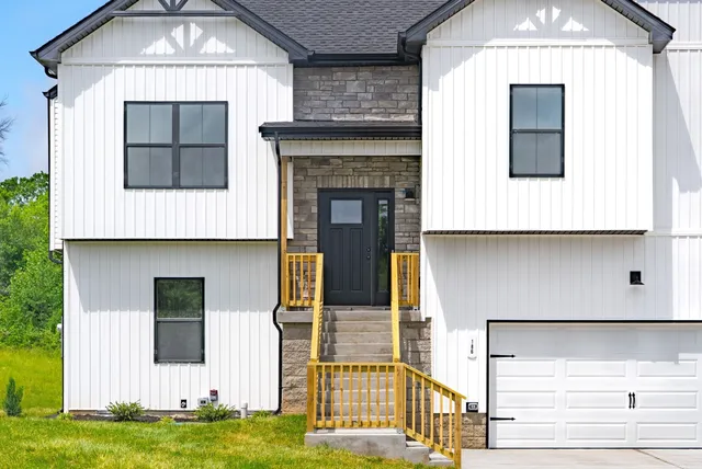 a living room with a fireplace and a space
