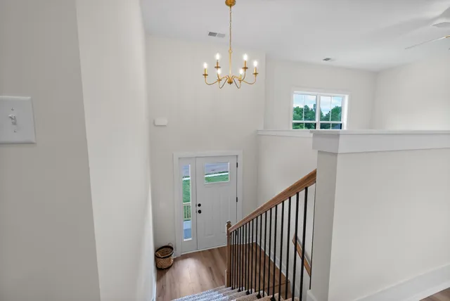 a living room with furniture a window and a fireplace
