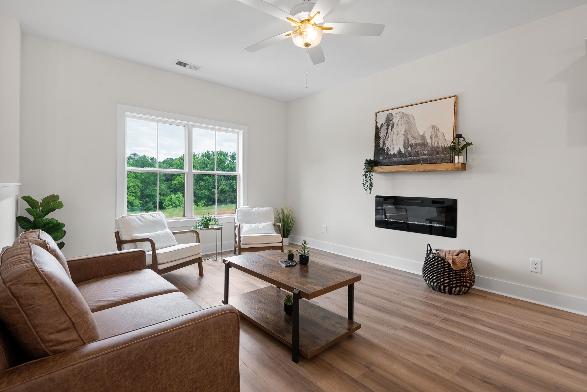 197 Dewberry Road Clarksville, TN 37042 - Photo 10 of 59 a living room with furniture a window and a fireplace