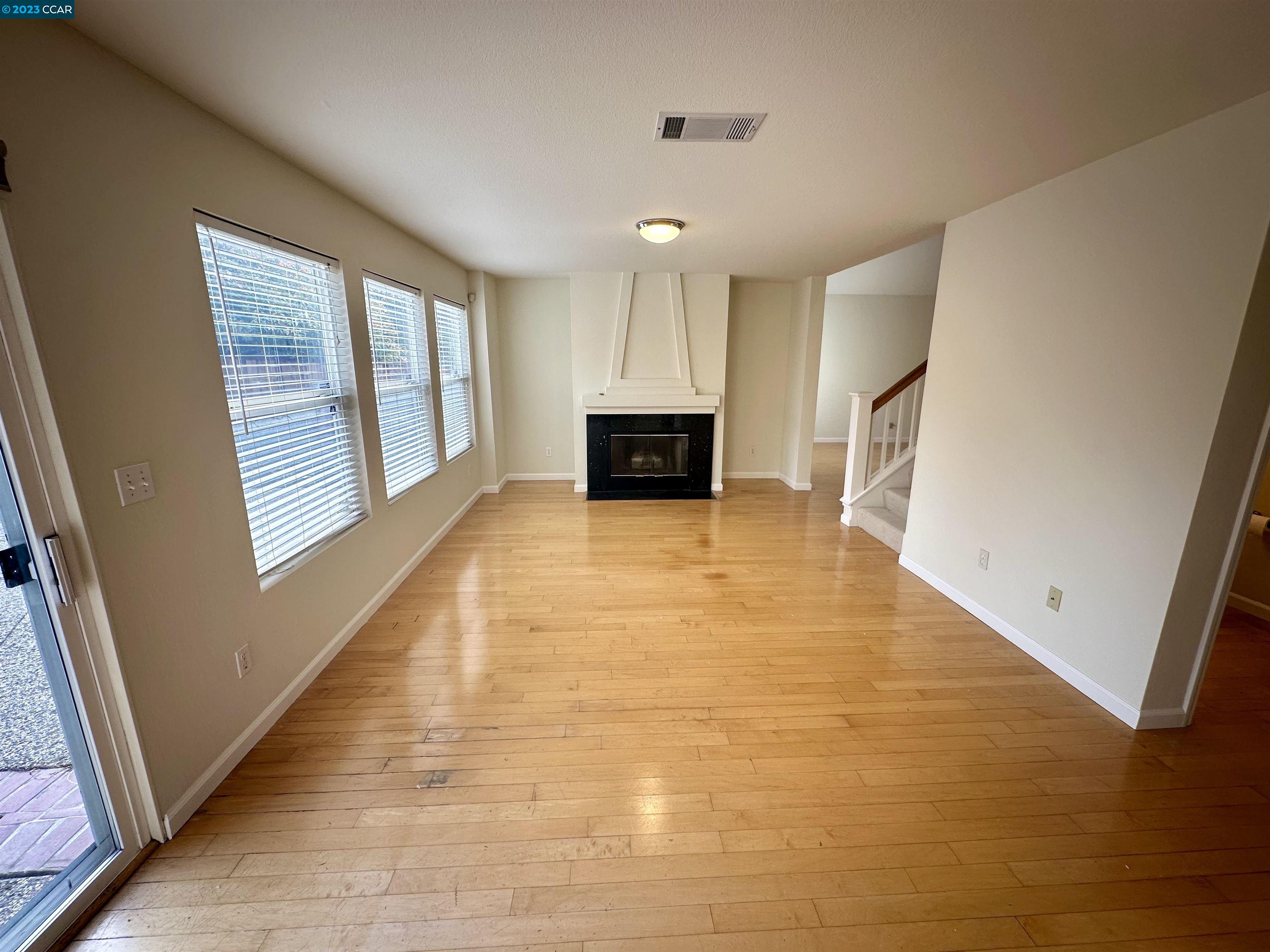 4653 Myrtle Drive Dublin, CA 94568 - Photo 11 of 25 a view of a hallway with wooden floor and staircase