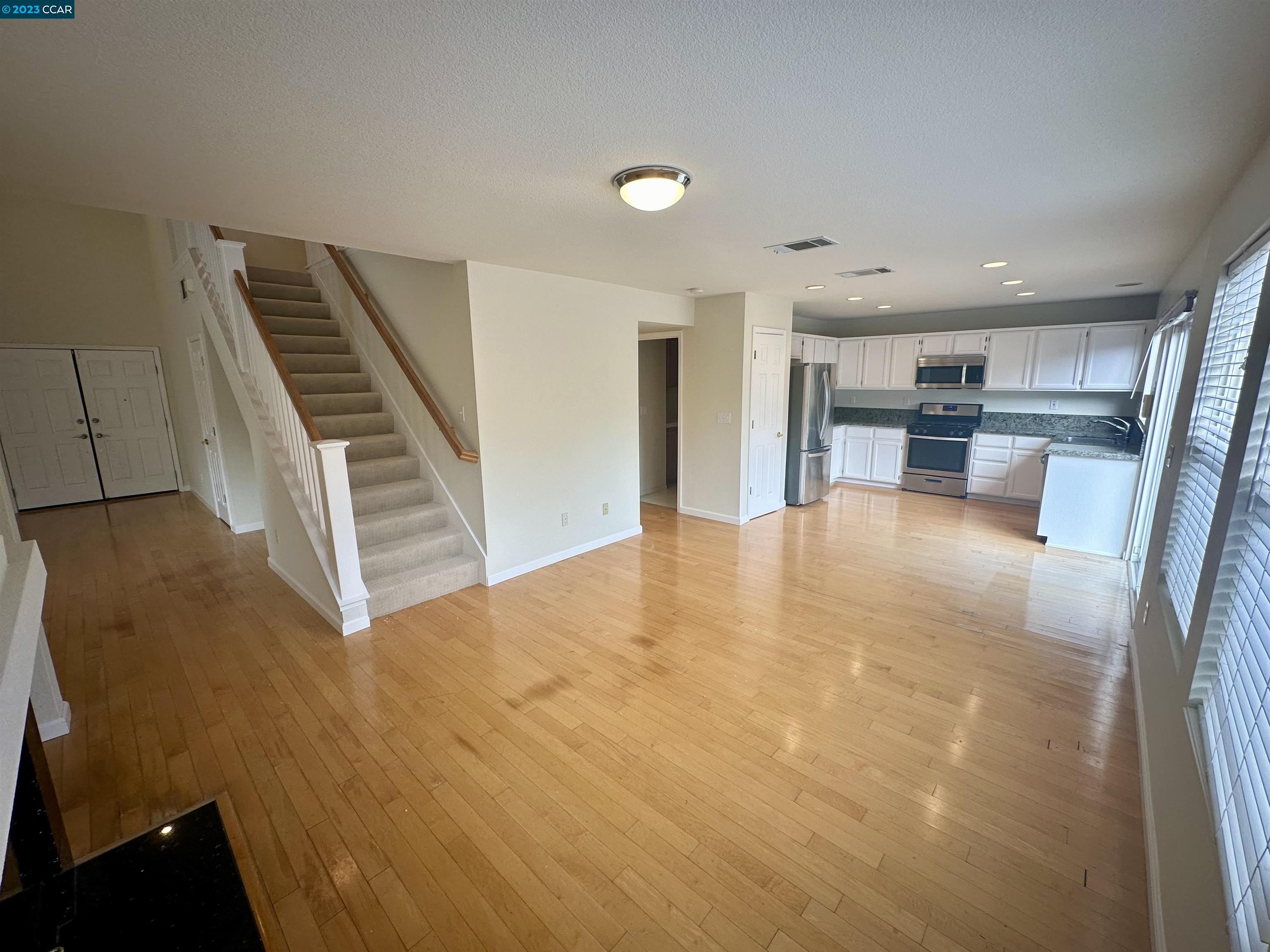 4653 Myrtle Drive Dublin, CA 94568 - Photo 8 of 25 a view of kitchen and dining room with wooden floor