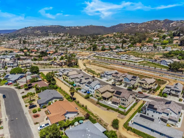 an aerial view of residential building with trees