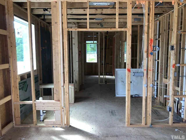 a view of a room with a floor to ceiling window next to a yard