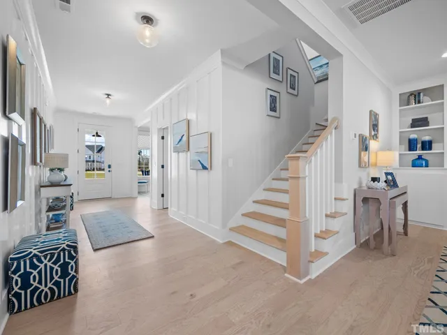 a living room with fireplace furniture and a flat screen tv