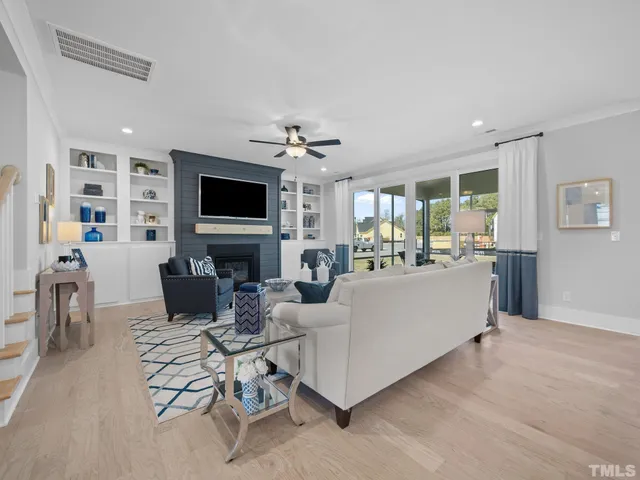 a living room with furniture and kitchen view