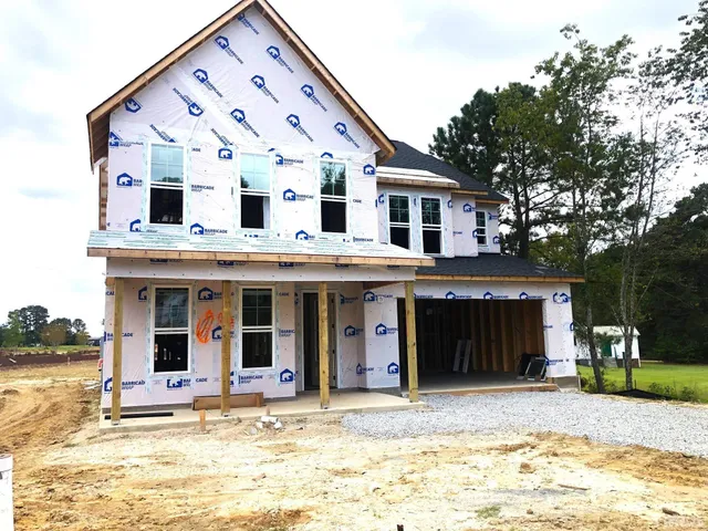 a view of a white building with a large windows