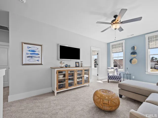 a bedroom with a bed mirror and window