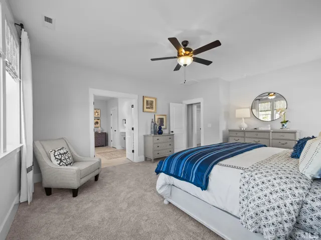 a spacious bathroom with double vanity sink and a mirror