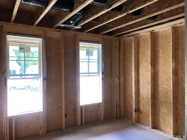 a view of an empty room with a balcony