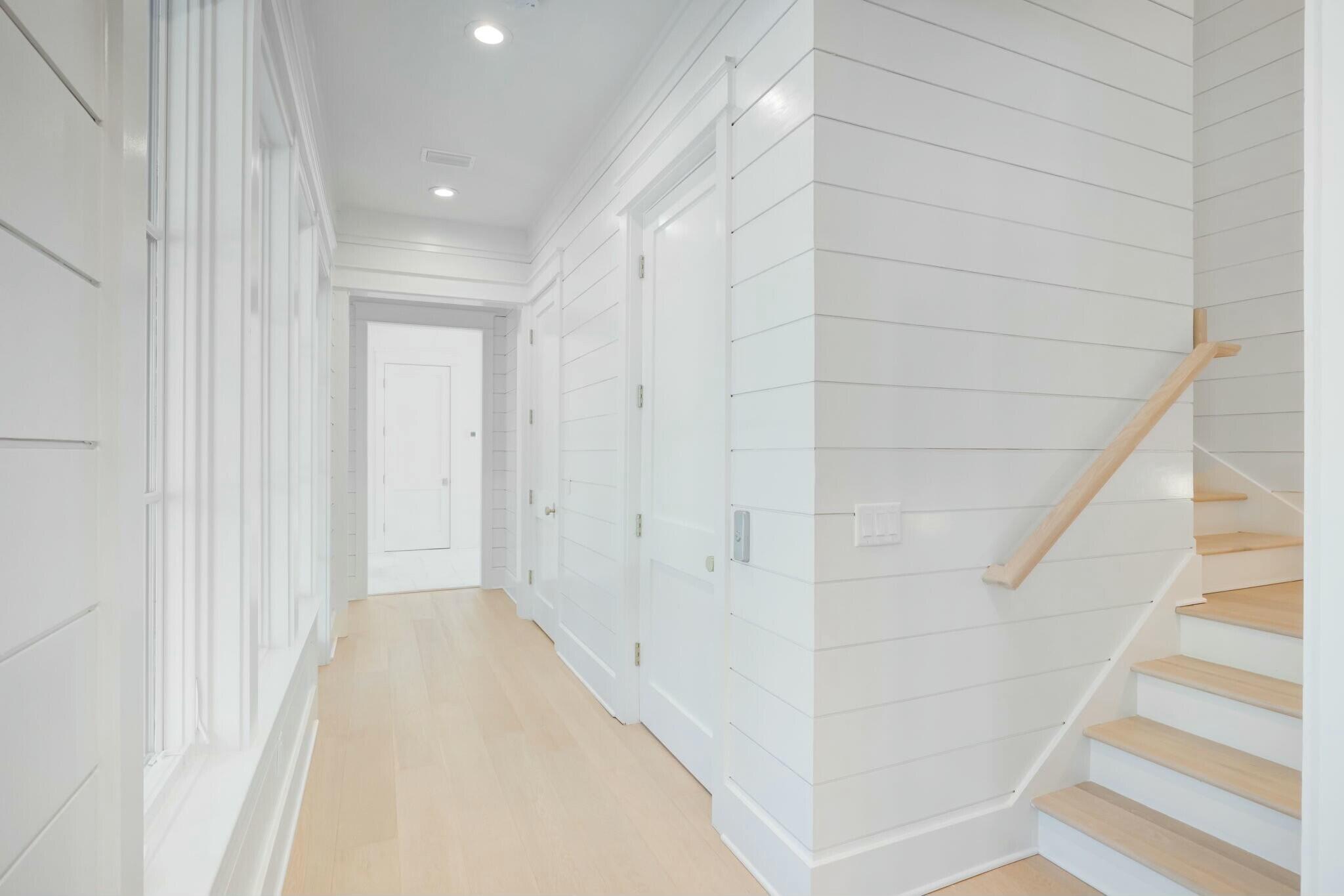40 Whispering Wind Way Santa Rosa Beach, FL 32459 - Photo 56 of 86 a view of a hallway with white walls and entryway