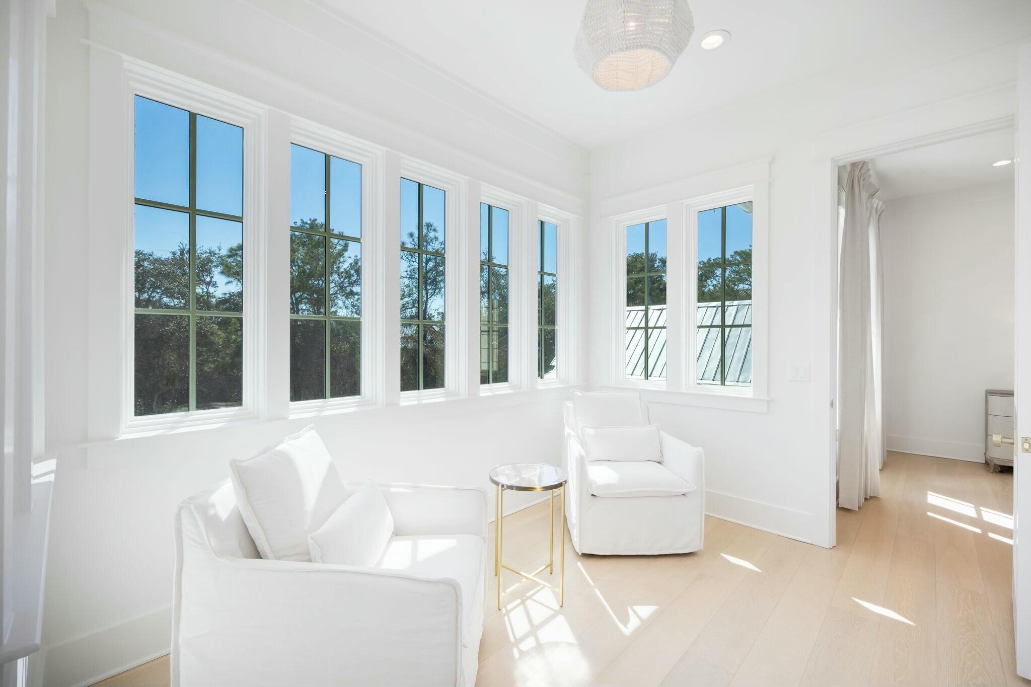 40 Whispering Wind Way Santa Rosa Beach, FL 32459 - Photo 61 of 86 a living room with furniture and large windows