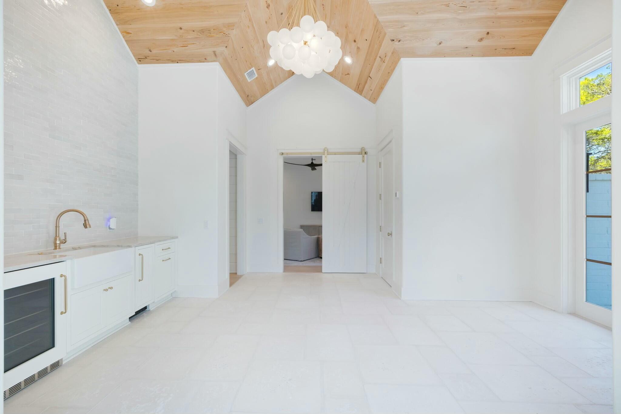 40 Whispering Wind Way Santa Rosa Beach, FL 32459 - Photo 76 of 86 a view of an empty room with chandelier