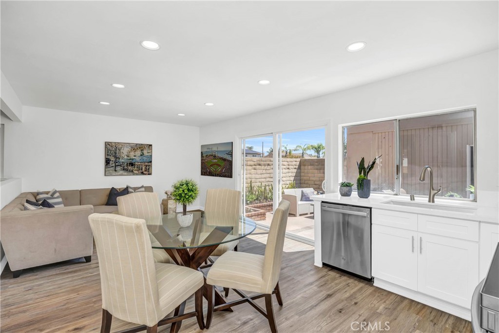 4345 Larwin Avenue Cypress, CA 90630 - Photo 15 of 54 a view of a dining room with furniture and wooden floor