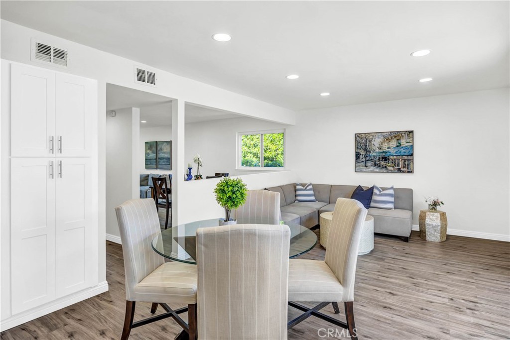 4345 Larwin Avenue Cypress, CA 90630 - Photo 16 of 54 a view of a dining room with furniture window and wooden floor
