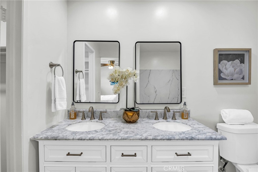 4345 Larwin Avenue Cypress, CA 90630 - Photo 27 of 54 a bathroom with double vanity sinks and a mirror