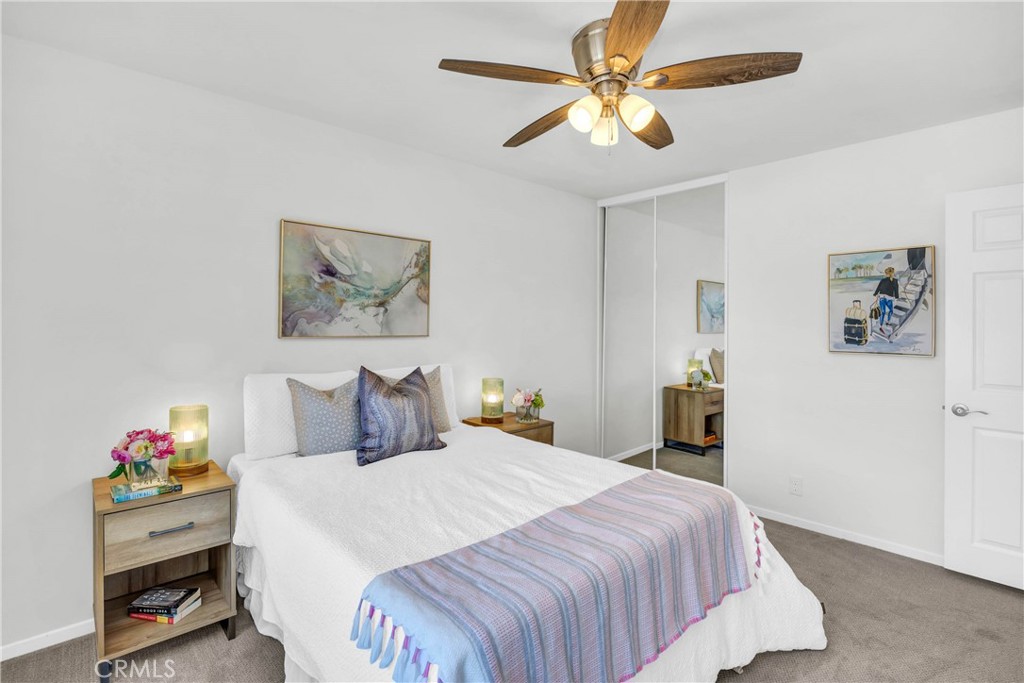 4345 Larwin Avenue Cypress, CA 90630 - Photo 28 of 54 a bedroom with a bed and a chandelier