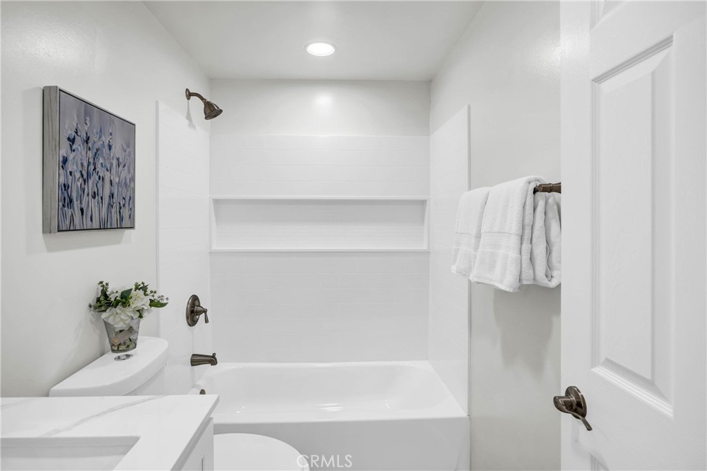 4345 Larwin Avenue Cypress, CA 90630 - Photo 31 of 54 a bathroom with a bathtub and a shower