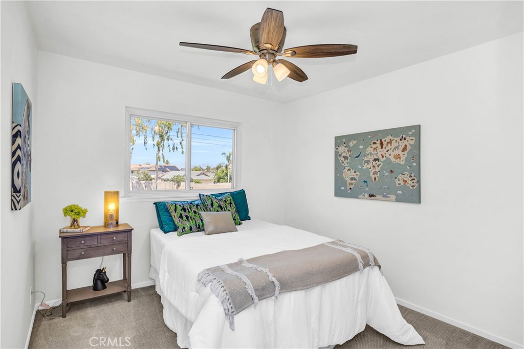 4345 Larwin Avenue Cypress, CA 90630 - Photo 32 of 54 a bedroom with a bed and a chandelier