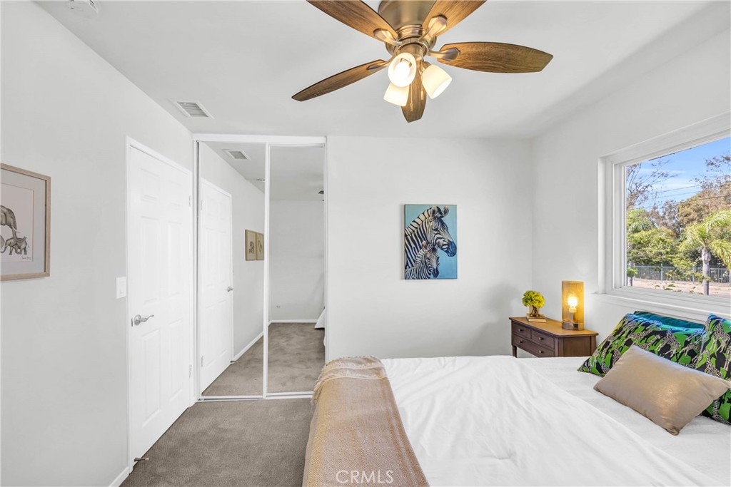 4345 Larwin Avenue Cypress, CA 90630 - Photo 33 of 54 a bedroom with a bed and a chandelier