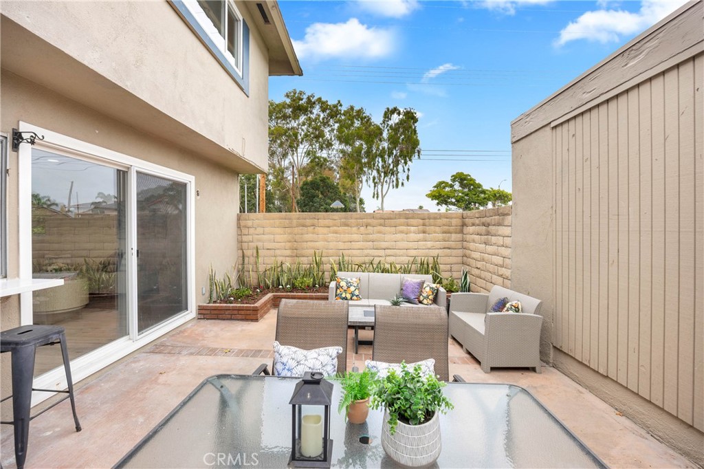 4345 Larwin Avenue Cypress, CA 90630 - Photo 35 of 54 a view of a patio with couches table and chairs and potted plants