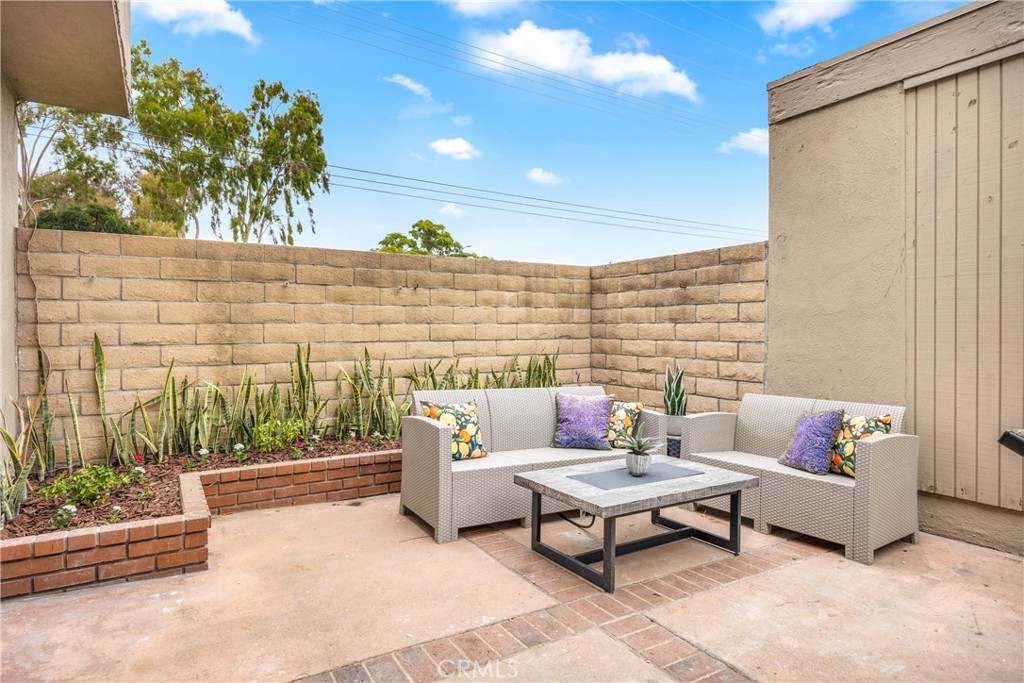 4345 Larwin Avenue Cypress, CA 90630 - Photo 36 of 54 a patio with patio couch and a potted plant