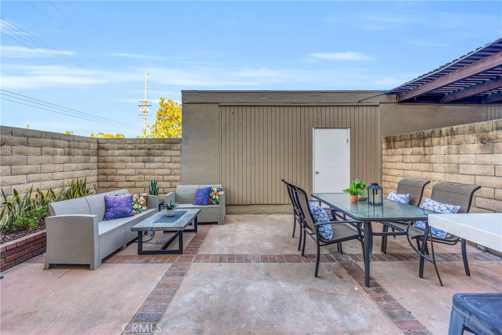 4345 Larwin Avenue Cypress, CA 90630 - Photo 38 of 54 a outdoor space with patio the couches and a potted plant on the table
