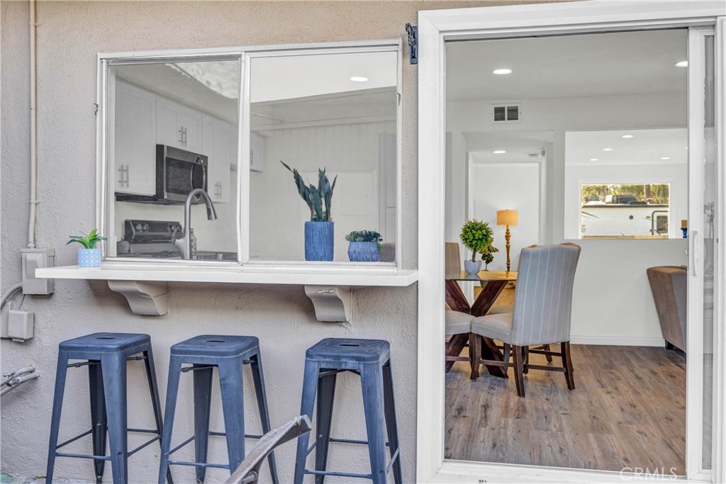 4345 Larwin Avenue Cypress, CA 90630 - Photo 39 of 54 a dining room with furniture and wooden floor