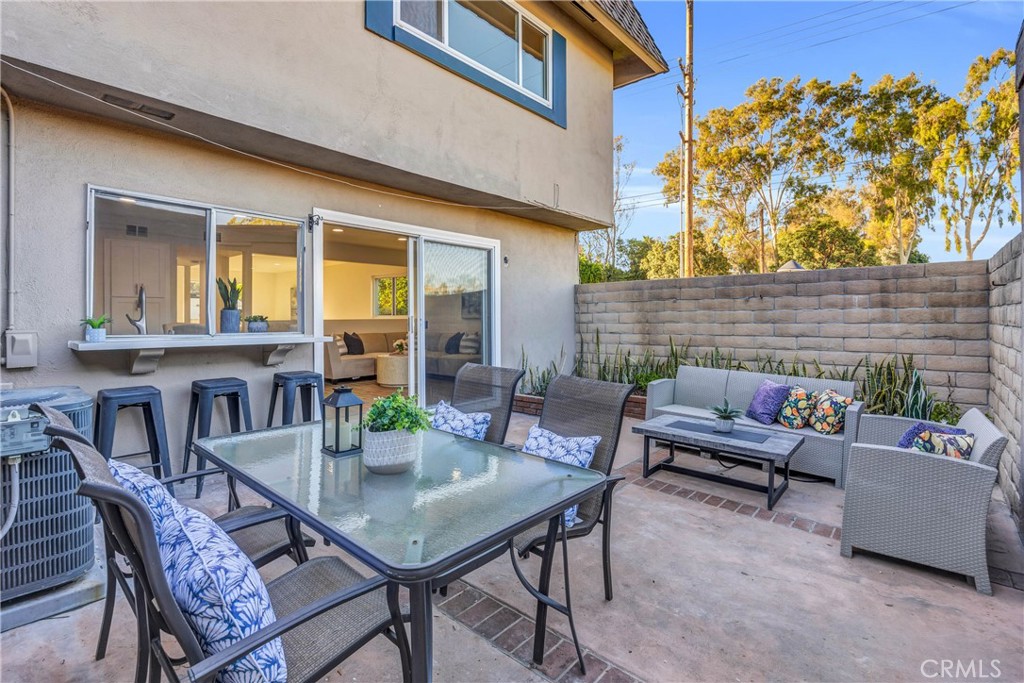 4345 Larwin Avenue Cypress, CA 90630 - Photo 40 of 54 a view of a patio with couches table and chairs