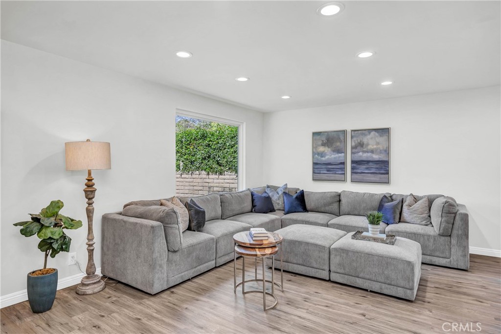 4345 Larwin Avenue Cypress, CA 90630 - Photo 4 of 54 a living room with furniture and a large window