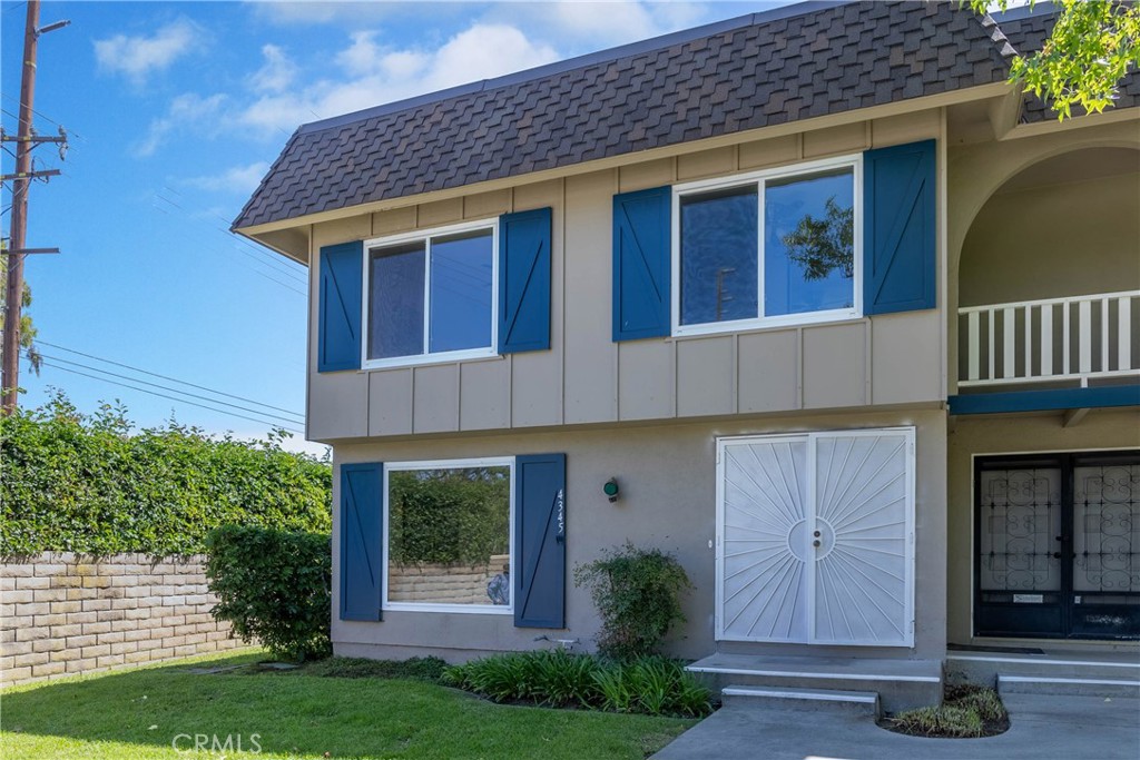 4345 Larwin Avenue Cypress, CA 90630 - Photo 46 of 54 a front view of a house with garden