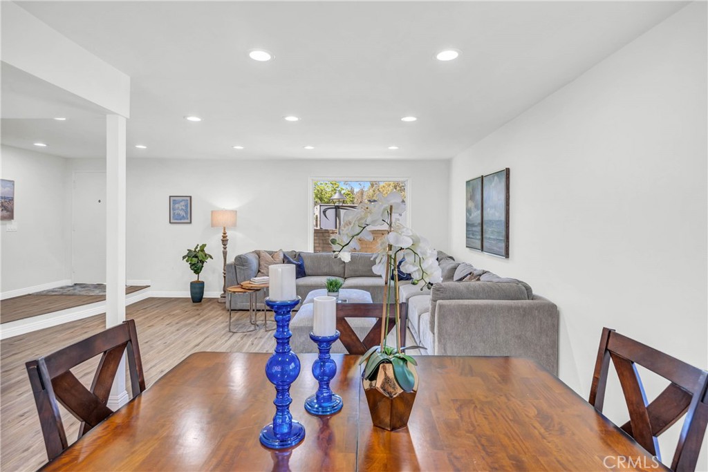 4345 Larwin Avenue Cypress, CA 90630 - Photo 6 of 54 a living room with fireplace furniture and a wooden floor