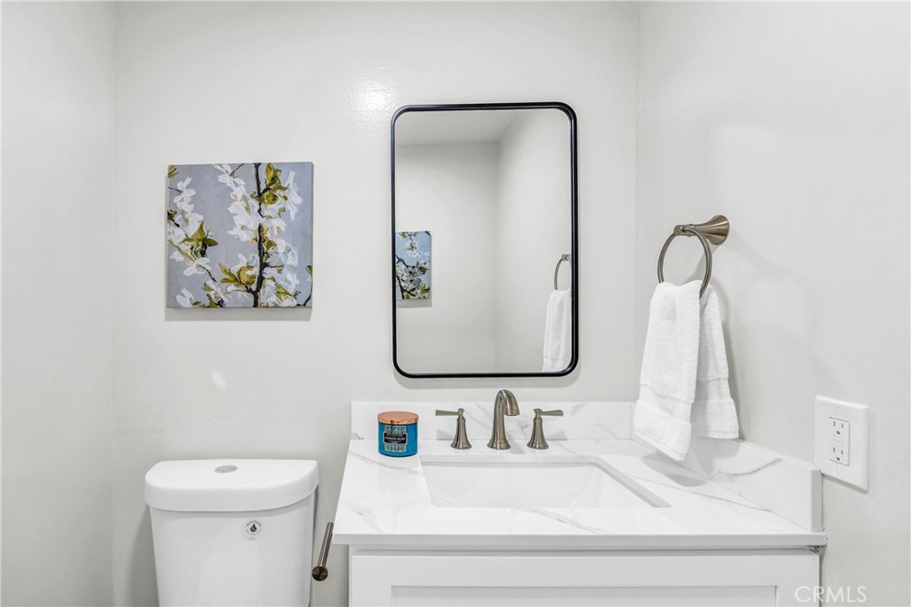 4345 Larwin Avenue Cypress, CA 90630 - Photo 9 of 54 a bathroom with a sink vanity and toilet