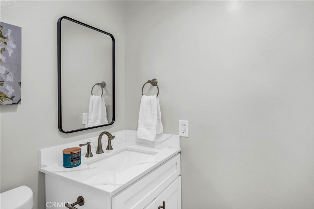 4345 Larwin Avenue Cypress, CA 90630 - Photo 10 of 54 a bathroom with a sink vanity and a mirror
