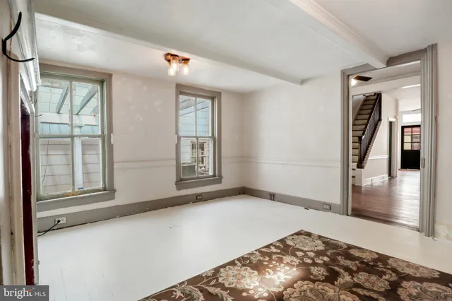 a view of entryway with wooden floor