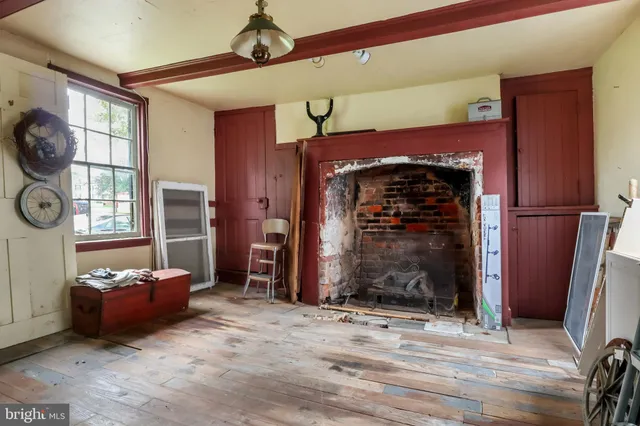 a spacious bedroom with a bed and a large window