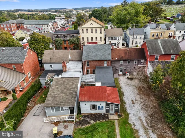 an aerial view of houses with outdoor space