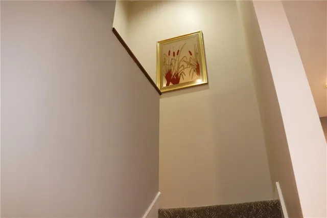 a view of a room with wooden floor and closet