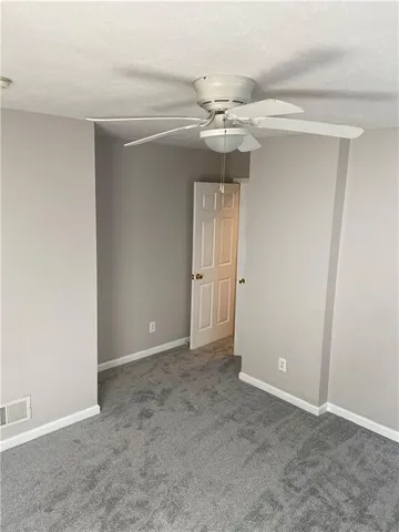 a bedroom with furniture and a flat screen tv