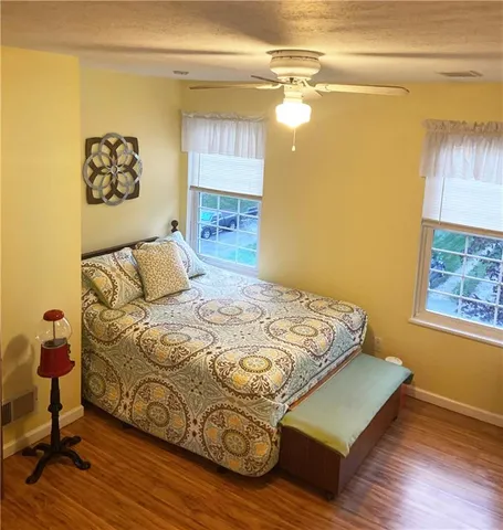 a bathroom with a sink a mirror and a shower