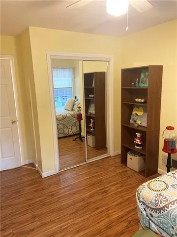 a view of a balcony with wooden floor