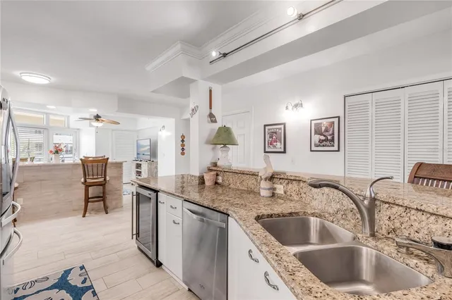 a bathroom with a double vanity sink mirror and toilet
