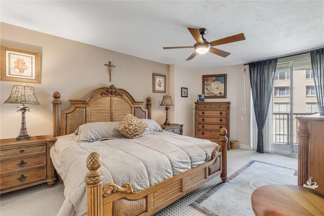 a view of a swimming pool and an outdoor seating