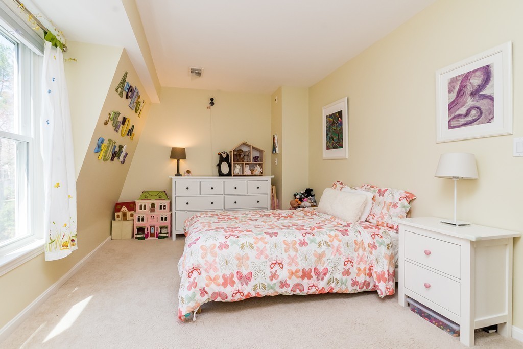 95 Anderer Lane, Unit 4 Boston, MA 02132 - Photo 12 of 22 a bedroom with a bed and a window