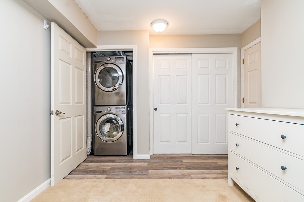 95 Anderer Lane, Unit 4 Boston, MA 02132 - Photo 16 of 22 a view of a storage and utility room with washer and dryer