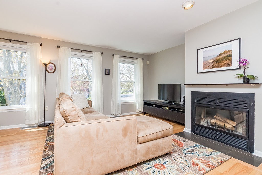95 Anderer Lane, Unit 4 Boston, MA 02132 - Photo 6 of 22 a living room with furniture a flat screen tv and a fireplace