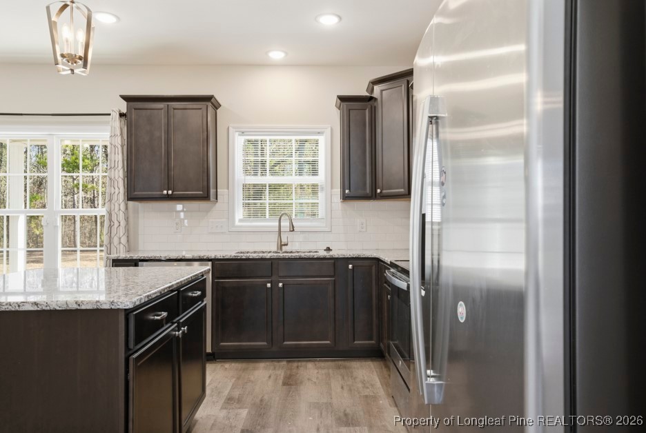 4830 Quiet Pine Road Fayetteville, NC 28314 - Photo 15 of 50 a kitchen with a sink stove and refrigerator